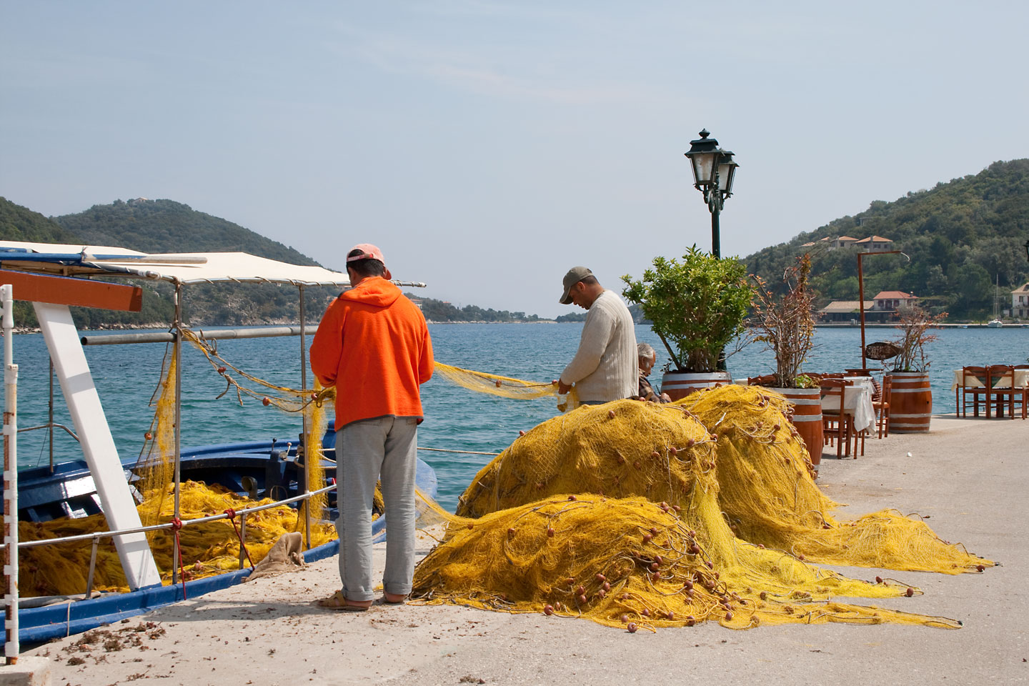 Fishermen holding fishing net | Lefkada